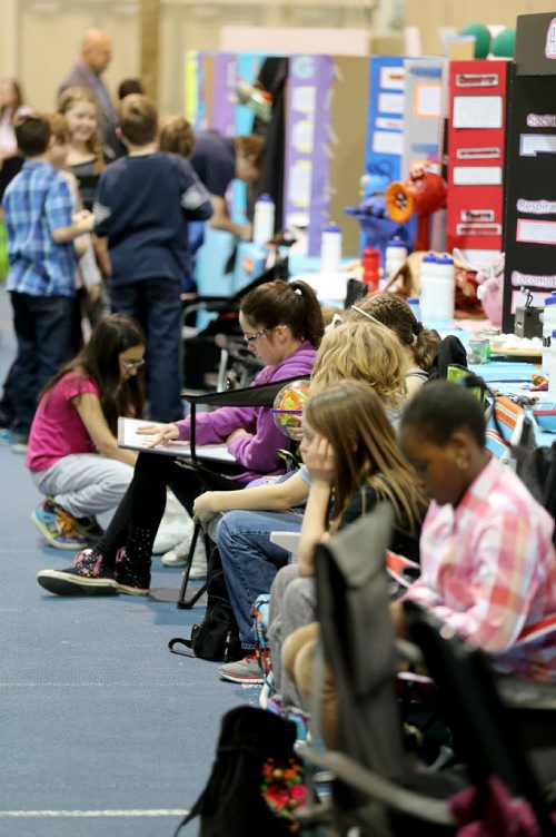 Students try to keep occupied at the Manitoba Schools Science Symposium, inside Max Bell Centre at the University of Manitoba, Saturday, April 25, 2015. (TREVOR HAGAN/WINNIPEG FREE PRESS)