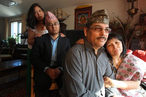 Chitra Pradham, his wife Manika (front on right), Purushottam Singh and his wife Archana (rear, left)  have family members  in Kathmandu which experienced ttremors early Saturday morning.   See Bill Redekop story.  Ruth Bonneville / Winnipeg Free Press April 25, 2015