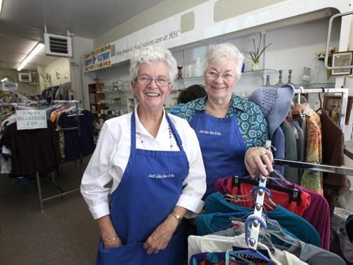 Just like New to You thrift store founders pose for photo in the store.  Money raised at the store goes to HSC Patient Care Volunteers.  Names of founders - Mabel Pratt (right)  and Carol Cribbs (left, white shirt).  See Aaron Epps Volunteer column   Ruth Bonneville / Winnipeg Free Press April 25, 2015