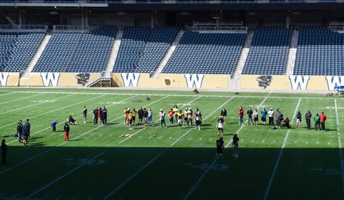 DAVID LIPNOWSKI / WINNIPEG FREE PRESS  Coaches and players run drills during the Winnipeg Blue Bombers coach camp Sunday April 26, 2015 at Investors Group Field.