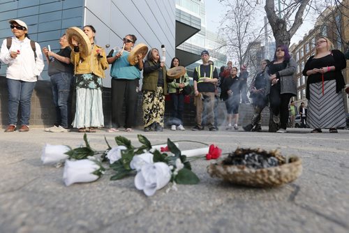 April 26, 2015 - 150426  -   People gather Sunday, April 26, 2015 on Carlton between Portage and Ellice for a vigil for two men killed . John Woods / Winnipeg Free Press