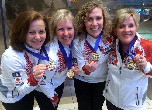 Winnipeg James Armstrong Richardson International Airport - Team Lois Fowler, senior women's world curling champions, arrive home after competition in Sochi, Russia. Left to right - Allyson Stewart (Lead) , Cathy Gauthier (Second), Maureen Bonar (Third, Vice-Skip), and Lois Fowler (Fourth, Skip). BORIS MINKEVICH/WINNIPEG FREE PRESS APRIL 27, 2015