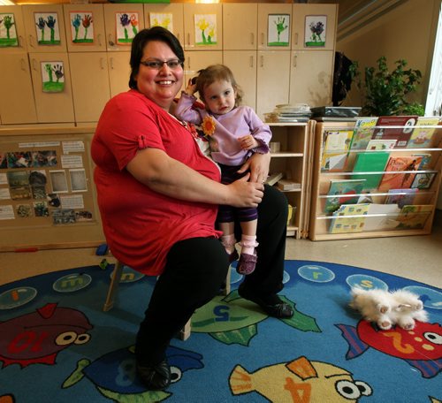 Daycare worker Robin Potter and her daughter River pose at SPLASH child care centre on McGregor, to illustrate Mary Agnes Welch story on care shortages..... April 27, 2015 - (Phil Hossack / Winnipeg Free Press)