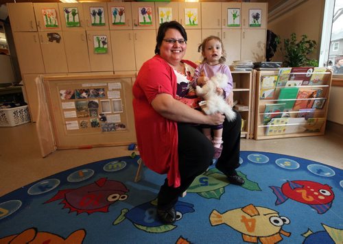 Daycare worker Robin Potter and her daughter River pose at SPLASH child care centre on McGregor, to illustrate Mary Agnes Welch story on care shortages..... April 27, 2015 - (Phil Hossack / Winnipeg Free Press)
