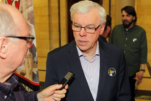 Day of Mourning Leaders Walk. SAFE Workers of Tomorrow Leaders Walk participants gathered at Union Centre, 275 Broadway, and marched down to the Manitoba Legislative Building. There a media event at the Manitoba Legislative Building commenced. In this photo Premier Greg Selinger talks to Larry Kusch after the event ended. BORIS MINKEVICH/WINNIPEG FREE PRESS APRIL 28, 2015