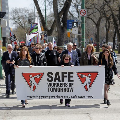 Day of Mourning Leaders Walk. SAFE Workers of Tomorrow Leaders Walk participants gathered at Union Centre, 275 Broadway, and marched down to the Manitoba Legislative Building.  Manitoba Premier Greg Selinger walks with the group( in the middle with white hair) BORIS MINKEVICH/WINNIPEG FREE PRESS APRIL 28, 2015