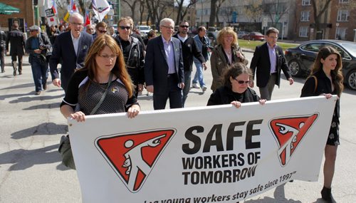 Day of Mourning Leaders Walk. SAFE Workers of Tomorrow Leaders Walk participants gathered at Union Centre, 275 Broadway, and marched down to the Manitoba Legislative Building.  Manitoba Premier Greg Selinger walks with the group( in the middle with white hair) BORIS MINKEVICH/WINNIPEG FREE PRESS APRIL 28, 2015