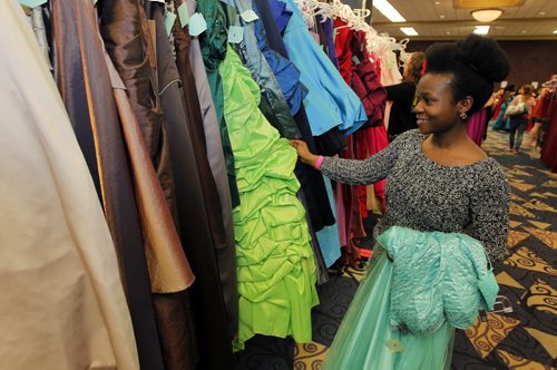 Senami Saibu from Fort Richmond Collegiate is choosing her grad dress today at the RBC Convention Centre as part of Gowns for Grads. This program hooks up students with donated grad dresses. JEN ZORATTI STORY. BORIS MINKEVICH/WINNIPEG FREE PRESS APRIL 28, 2015