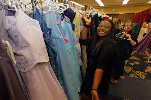 Precious Phillips from Fort Richmond Collegiate is choosing her grad dress today at the RBC Convention Centre as part of Gowns for Grads. This program hooks up students with donated grad dresses. JEN ZORATTI STORY. BORIS MINKEVICH/WINNIPEG FREE PRESS APRIL 28, 2015