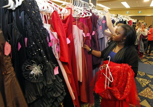Precious Phillips from Fort Richmond Collegiate is choosing her grad dress today at the RBC Convention Centre as part of Gowns for Grads. This program hooks up students with donated grad dresses. JEN ZORATTI STORY. BORIS MINKEVICH/WINNIPEG FREE PRESS APRIL 28, 2015