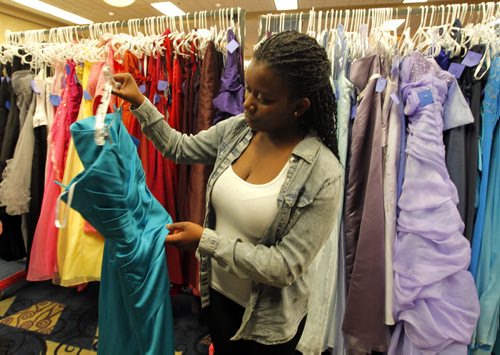 Aurore Ingenere from Fort Richmond Collegiate is choosing her grad dress today at the RBC Convention Centre as part of Gowns for Grads. This program hooks up students with donated grad dresses. JEN ZORATTI STORY. BORIS MINKEVICH/WINNIPEG FREE PRESS APRIL 28, 2015