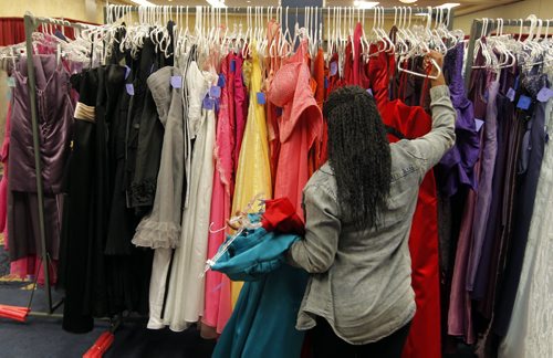 Aurore Ingenere from Fort Richmond Collegiate is choosing her grad dress today at the RBC Convention Centre as part of Gowns for Grads. This program hooks up students with donated grad dresses. JEN ZORATTI STORY. BORIS MINKEVICH/WINNIPEG FREE PRESS APRIL 28, 2015