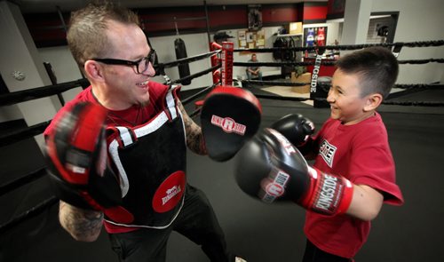 Zack O'Grady a young protoge of Roland Vandal, spars with his coach and mentor during a workout at Elite Gym where Vandal trains his boxers. See Geoff Kirbyson story re:boxer turned author. April 28, 2015 - (Phil Hossack / Winnipeg Free Press)