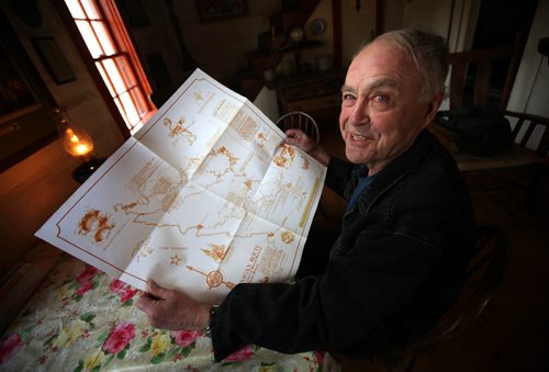 Real Berard show off one of his map routes at a table in his restored log cabin retreat near St Pierre. He's an artist, canoe route mapper, and political cartoonist. See Bill Redekop's story. April 29, 2015 - (Phil Hossack / Winnipeg Free Press)