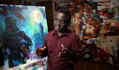 Artist Yisa Akinbolaji and his art that will be featured in the upcoming YorubaFest art exhibition  the Yoruba are a southwest African tribe mainly from Nigeria, Benin, Burkina Faso and Togo  and they have cool art including pottery, weaving, beadwork, metalwork, and mask making. See Carol Sanders story. April 29, 2015 - (Phil Hossack / Winnipeg Free Press)