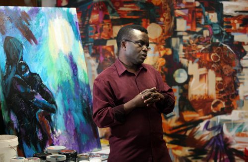 Artist Yisa Akinbolaji and his art that will be featured in the upcoming YorubaFest art exhibition  the Yoruba are a southwest African tribe mainly from Nigeria, Benin, Burkina Faso and Togo  and they have cool art including pottery, weaving, beadwork, metalwork, and mask making. See Carol Sanders story. April 29, 2015 - (Phil Hossack / Winnipeg Free Press)