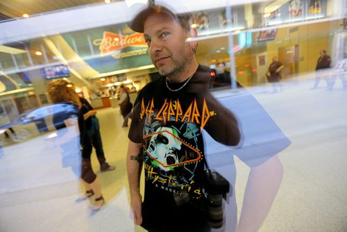 A Def Leppard fan proudly displays a concert t-shirt through a window at MTS Centre before the band was set to take the stage, Wednesday, April 30, 2015. Photographers are not allowed inside the venue to cover tonights show. (TREVOR HAGAN/WINNIPEG FREE PRESS)