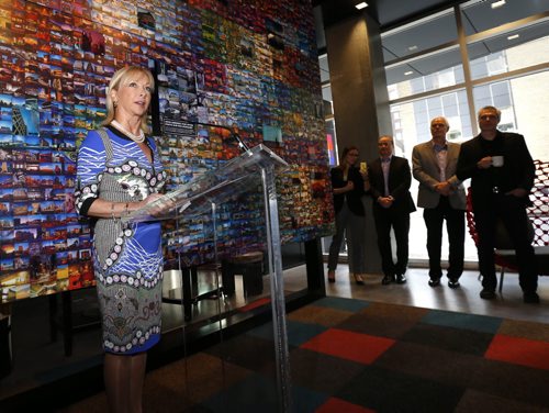 Christiane Germain, co-president of Groupe Germain Hotels at the official opening Thursday of the Alt Hotel at Centrepoint across from the MTS Centre on Portage Ave. She is at the podium in the lobby in front of an art installation composed of 2500 Winnipeg photographs by artist Bryan Scott. Wayne Glowacki / Winnipeg Free Press April 30 2015