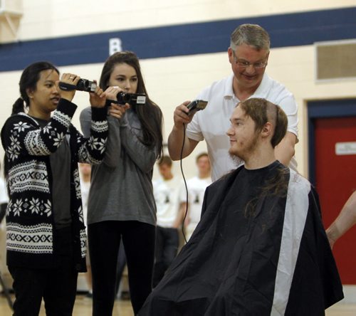 This week Shaftesbury is having a fundraising event in order to raise money for Cancer Care Manitoba. There will be different events all week, with the headline being Brave the Shave event today. Almost 20 participants are willing to shave their head in order to raise money, and show their support. There have been multiple staff members at our school that have fought cancer in the past three years. Students and staff have came together at Shaftesbury to fight with them in their battles. April is daffodil month for the cancer care foundation. Grade 10 student Ian Collett gets his lid shaved by social studies teacher Steve Peers. BORIS MINKEVICH/WINNIPEG FREE PRESS APRIL 30, 2015
