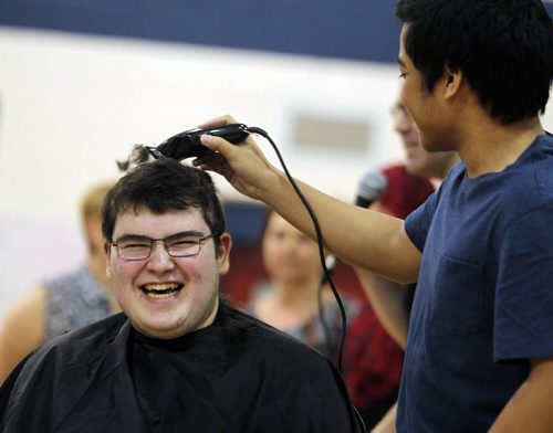 This week Shaftesbury is having a fundraising event in order to raise money for Cancer Care Manitoba. There will be different events all week, with the headline being Brave the Shave event today. Almost 20 participants are willing to shave their head in order to raise money, and show their support. There have been multiple staff members at our school that have fought cancer in the past three years. Students and staff have came together at Shaftesbury to fight with them in their battles. April is daffodil month for the cancer care foundation. Student Matt Wire gets shaved by student Jordi Nicanor. BORIS MINKEVICH/WINNIPEG FREE PRESS APRIL 30, 2015