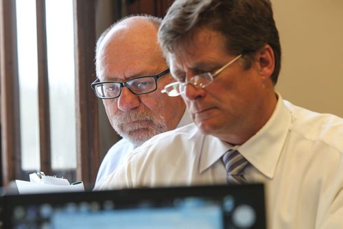Reporters Larry Kusch and Bruce Owen read the 2015 Provincial Budget in the media lockup prior to the Finance Minister's presentation to the provincial assembly Thursday afternoon. 150430 - Thursday, April 30, 2015 -  (MIKE DEAL / WINNIPEG FREE PRESS)