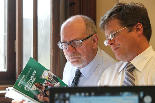Reporters Larry Kusch and Bruce Owen read the 2015 Provincial Budget in the media lockup prior to the Finance Minister's presentation to the provincial assembly Thursday afternoon. 150430 - Thursday, April 30, 2015 -  (MIKE DEAL / WINNIPEG FREE PRESS)