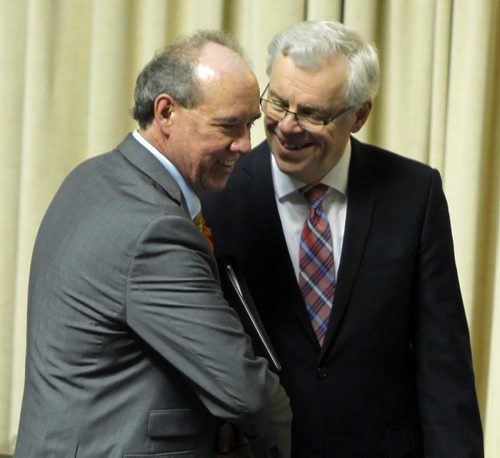 Manitoba's new finance minister, Greg Dewar, presents his first budget in Winnipeg on Thursday afternoon. Here he, left, is greeted by Premier Greg Selinger. BORIS MINKEVICH/WINNIPEG FREE PRESS APRIL 30, 2015
