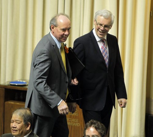 Manitoba's new finance minister, Greg Dewar, presents his first budget in Winnipeg on Thursday afternoon. Here he, left, is greeted by Premier Greg Selinger. BORIS MINKEVICH/WINNIPEG FREE PRESS APRIL 30, 2015