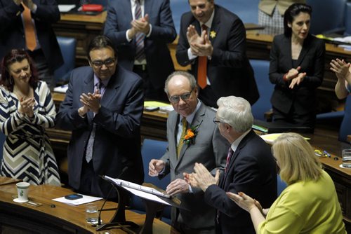 (centre staring at portable podium) Manitoba's new finance minister, Greg Dewar, presents his first budget in Winnipeg on Thursday afternoon. BORIS MINKEVICH/WINNIPEG FREE PRESS APRIL 30, 2015