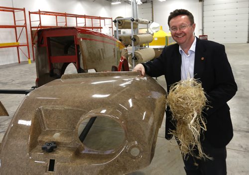 Simon Potter,  v.p. Product Inovation at FibreCITY, The Composites Innovation Centre in the pilot scale area holding some flax fibre (made from the decortication equipment ) beside a tractor hood made with bio-fibre including hemp.    Martin Cash Wayne Glowacki / Winnipeg Free Press April 30 2015