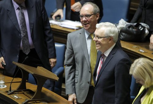 (with round glasses) Manitoba's new finance minister, Greg Dewar, presents his first budget in Winnipeg on Thursday afternoon. (white hair) The Premier Greg Selinger. BORIS MINKEVICH/WINNIPEG FREE PRESS APRIL 30, 2015