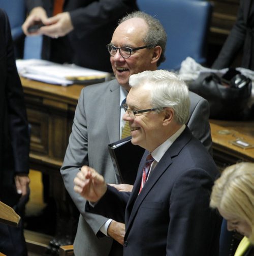 (holding a black portfolio) Manitoba's new finance minister, Greg Dewar, presents his first budget in Winnipeg on Thursday afternoon.  (white hair) The Premier Greg Selinger. BORIS MINKEVICH/WINNIPEG FREE PRESS APRIL 30, 2015