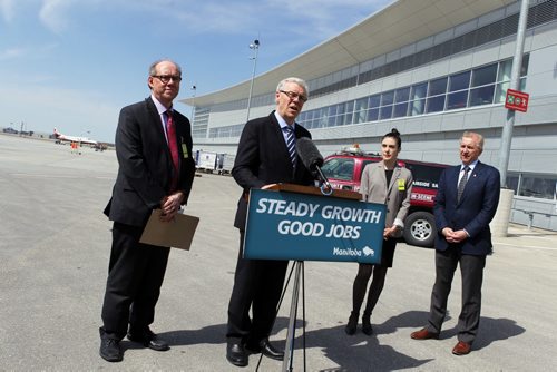 Jet fuel tax rebate announcement at the Winnipeg James Armstrong Richardson International Airport.  left to right - Manitoba finance minister Greg Dewar, Premier Greg Selinger, Manitoba minister for healthy living and seniors Deanne Crothers, and Winnipeg Airports Authority Barry Rempel, on the back tarmac. BORIS MINKEVICH/WINNIPEG FREE PRESS May 1, 2015