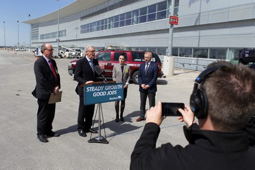 Jet fuel tax rebate announcement at the Winnipeg James Armstrong Richardson International Airport.  left to right - Manitoba finance minister Greg Dewar, Premier Greg Selinger, Manitoba minister for healthy living and seniors Deanne Crothers, and Winnipeg Airports Authority Barry Rempel, on the back tarmac. BORIS MINKEVICH/WINNIPEG FREE PRESS May 1, 2015