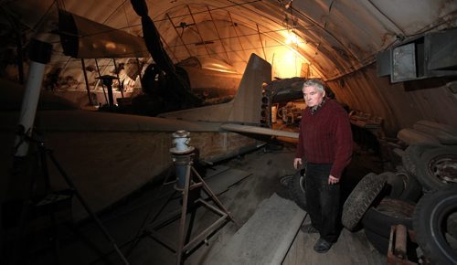 75 yr old Bob Diemert with some of the many aircraft stored in various old hangars in various stages of repair at his "Friendship FIeld" airstrip at Carman Mb. See Bill Redekop story.  May 1, 2015 - (Phil Hossack / Winnipeg Free Press)
