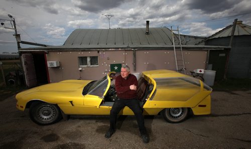 75 yr old Bob Diemert sits on his home built car at his "Friendship FIeld" airstrip at Carman Mb. See Bill Redekop story.  May 1, 2015 - (Phil Hossack / Winnipeg Free Press)