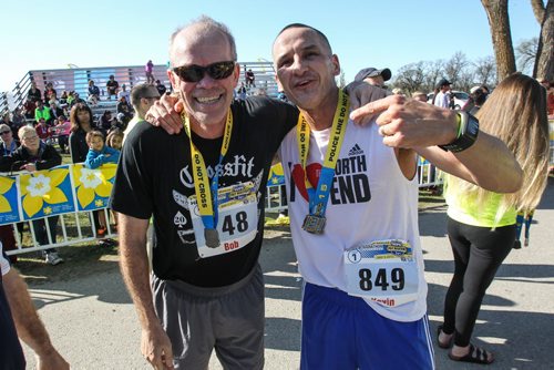 Winnipeg Free Press publisher Bob Cox and Kevin Chief after finishing the Winnipeg Police Half-Marathon at Assiniboine Park Sunday morning. 150503 - Sunday, May 03, 2015 -  (MIKE DEAL / WINNIPEG FREE PRESS)