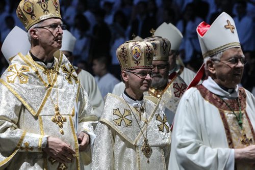 Thousands of Catholics gathered at the MTS Centre to take part in the Centennial Mass Sunday afternoon. The procession of priests walk onto the floor of the arena at the beginning of the event. 150503 - Sunday, May 03, 2015 -  (MIKE DEAL / WINNIPEG FREE PRESS)