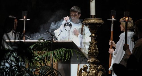 Thousands of Catholics gathered at the MTS Centre to take part in the Centennial Mass Sunday afternoon. A priest uses incense during the event.  150503 - Sunday, May 03, 2015 -  (MIKE DEAL / WINNIPEG FREE PRESS)