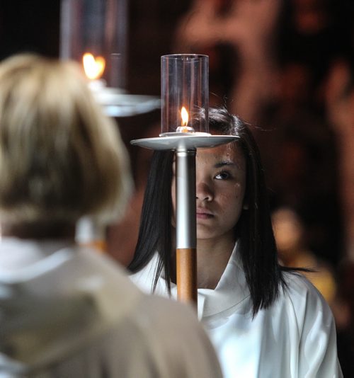 Thousands of Catholics gathered at the MTS Centre to take part in the Centennial Mass Sunday afternoon. Service helpers hold candles during the event. 150503 - Sunday, May 03, 2015 -  (MIKE DEAL / WINNIPEG FREE PRESS)