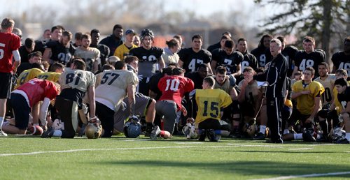 University of Manitoba Bisons head coach Brian Dobie speaking to the players after the completion of spring camp, Sunday, May 3, 2015. (TREVOR HAGAN/WINNIPEG FREE PRESS)