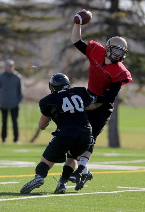 University of Manitoba Bisons Ashton Mackinnon tries to evade a defender during spring camp, Sunday, May 3, 2015. (TREVOR HAGAN/WINNIPEG FREE PRESS)