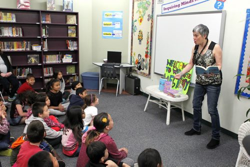 ENT - Actress and writer Meg Tilly reads to King Edward School students in the school's library. Randall King story. BORIS MINKEVICH/WINNIPEG FREE PRESS May 4, 2015