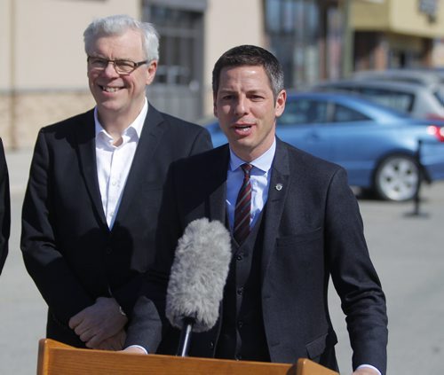LOCAL - Premier Greg Selinger, Mayor Brian Bowman. Press conference at Boston Pizza parking lot, corner of Ness Avenue and St. James Street TOPIC: Province's annual funding to the City of Winnipeg to improve city streets and create jobs. BORIS MINKEVICH/WINNIPEG FREE PRESS May 4, 2015