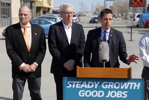 LOCAL - Minister of Municipal Government Drew Caldwell, Premier Greg Selinger, Mayor Brian Bowman. Press conference at Boston Pizza parking lot, corner of Ness Avenue and St. James Street TOPIC: Province's annual funding to the City of Winnipeg to improve city streets and create jobs. BORIS MINKEVICH/WINNIPEG FREE PRESS May 4, 2015