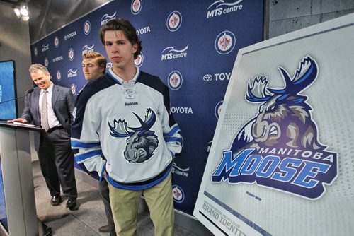 Manitoba Moose Scott Kosmachuk (24) models the new jersey for the Winnipeg Jets affiliate AHL team which is moving back to Winnipeg next season.  150504 May 4, 2015 Mike Deal / Winnipeg Free Press