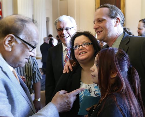 New MLA for The Pas Amanda Lathlin with her daughter Elyse along with from left Bidhu Jha,MLA, Premier Greg Selinger and Rob Altemeyer, MLA after her swearing in ceremony at the Manitoba Legislative Bld. Monday.see release Wayne Glowacki / Winnipeg Free Press May 4 2015