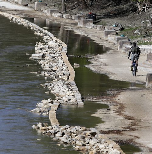 It was the end of the trail for this cyclist Tuesday arriving at a section of the The Assiniboine Riverwalk taking on river water near the Midtown Bridge.   Wayne Glowacki / Winnipeg Free Press May 5 2015