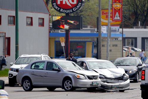 LOCAL - MVC - A car crash on South Osborne aroung 2pm. The driver of one car is calling for help. The elderly driver in the other car is still in the car. Across the street from the South Osborne transit garage. BORIS MINKEVICH/WINNIPEG FREE PRESS May 5, 2015