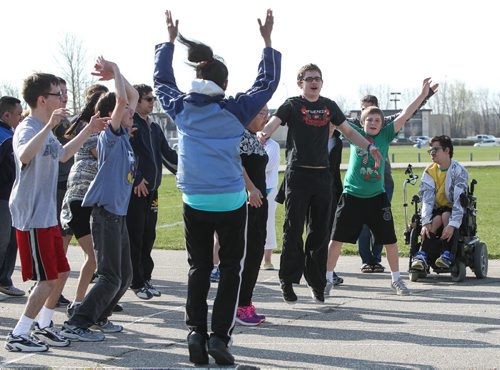 Teacher Bobbi Milberg's special education physical education class training on the field beside Grant Park Collegiate. Some of the intellectually challenged students will be taking part in this years provincial track and field championships. 150505 - Tuesday, May 05, 2015 -  (MIKE DEAL / WINNIPEG FREE PRESS)